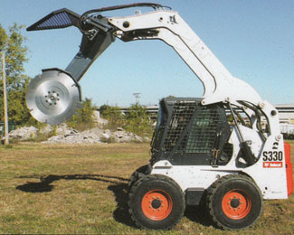Tree Cutter Mounted On Skid Loader, Blade in Vertical Position