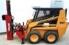 Post Driver Mounted On A Case Loader